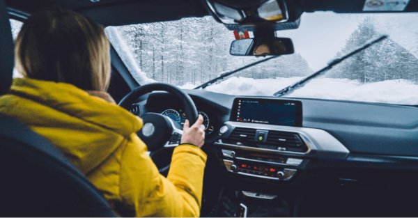 Woman behind the wheel in winter conditions